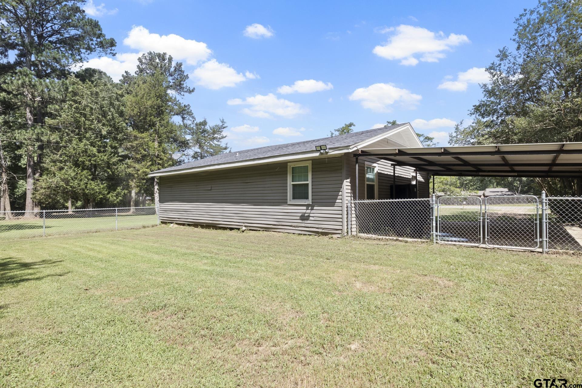 655 Daingerfield Street Pittsburg, TX 75686 - Photo 20 of 27 a front view of house with yard