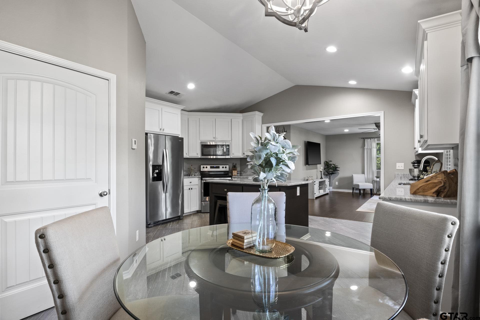 655 Daingerfield Street Pittsburg, TX 75686 - Photo 23 of 27 a dining room with furniture and kitchen view