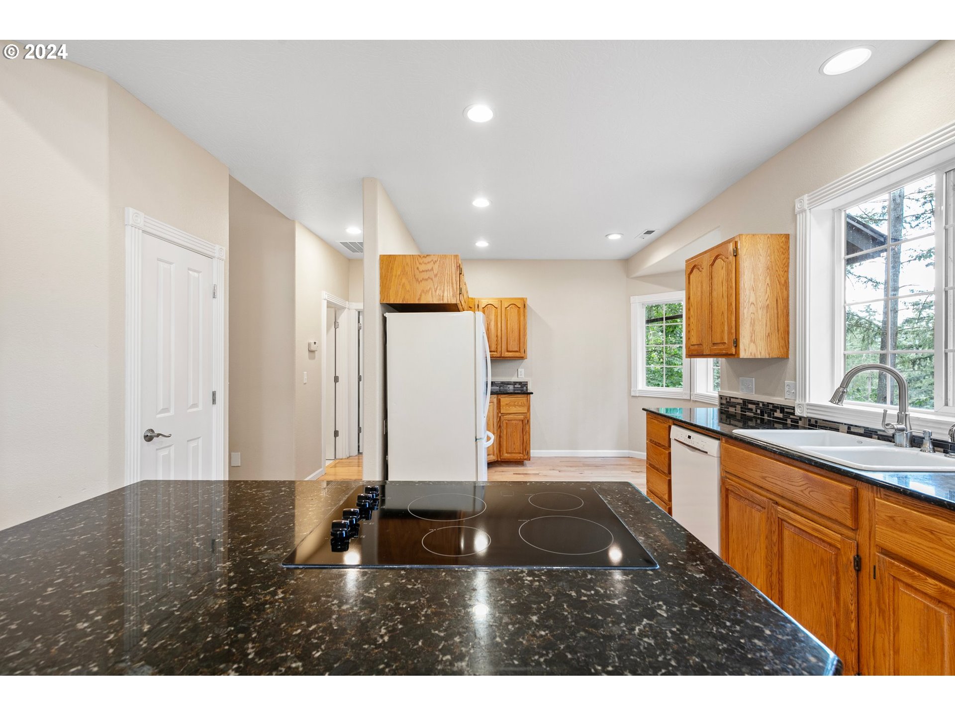 626 South 73rd Street Springfield, OR 97478 - Photo 11 of 46 a kitchen with stainless steel appliances granite countertop a sink stove and cabinets