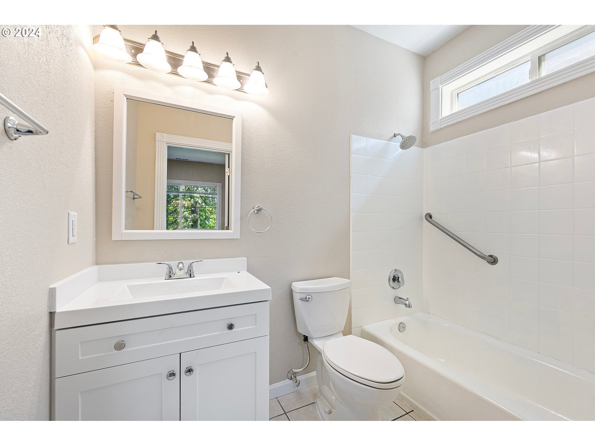 626 South 73rd Street Springfield, OR 97478 - Photo 20 of 46 a bathroom with a toilet sink a mirror and shower