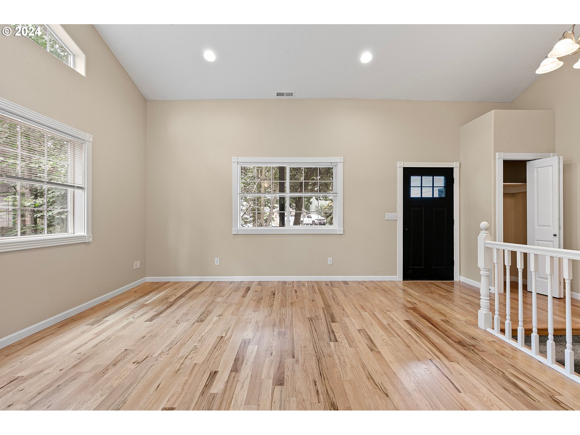 626 South 73rd Street Springfield, OR 97478 - Photo 2 of 46 a view of an empty room with wooden floor and a window
