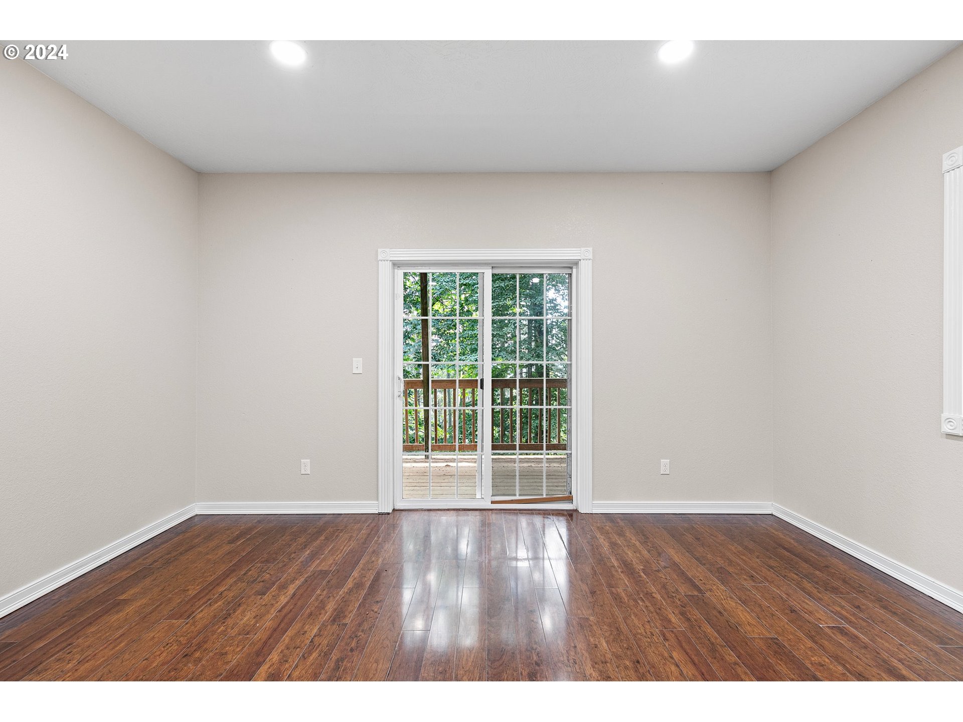 626 South 73rd Street Springfield, OR 97478 - Photo 25 of 46 a view of an empty room with wooden floor and window