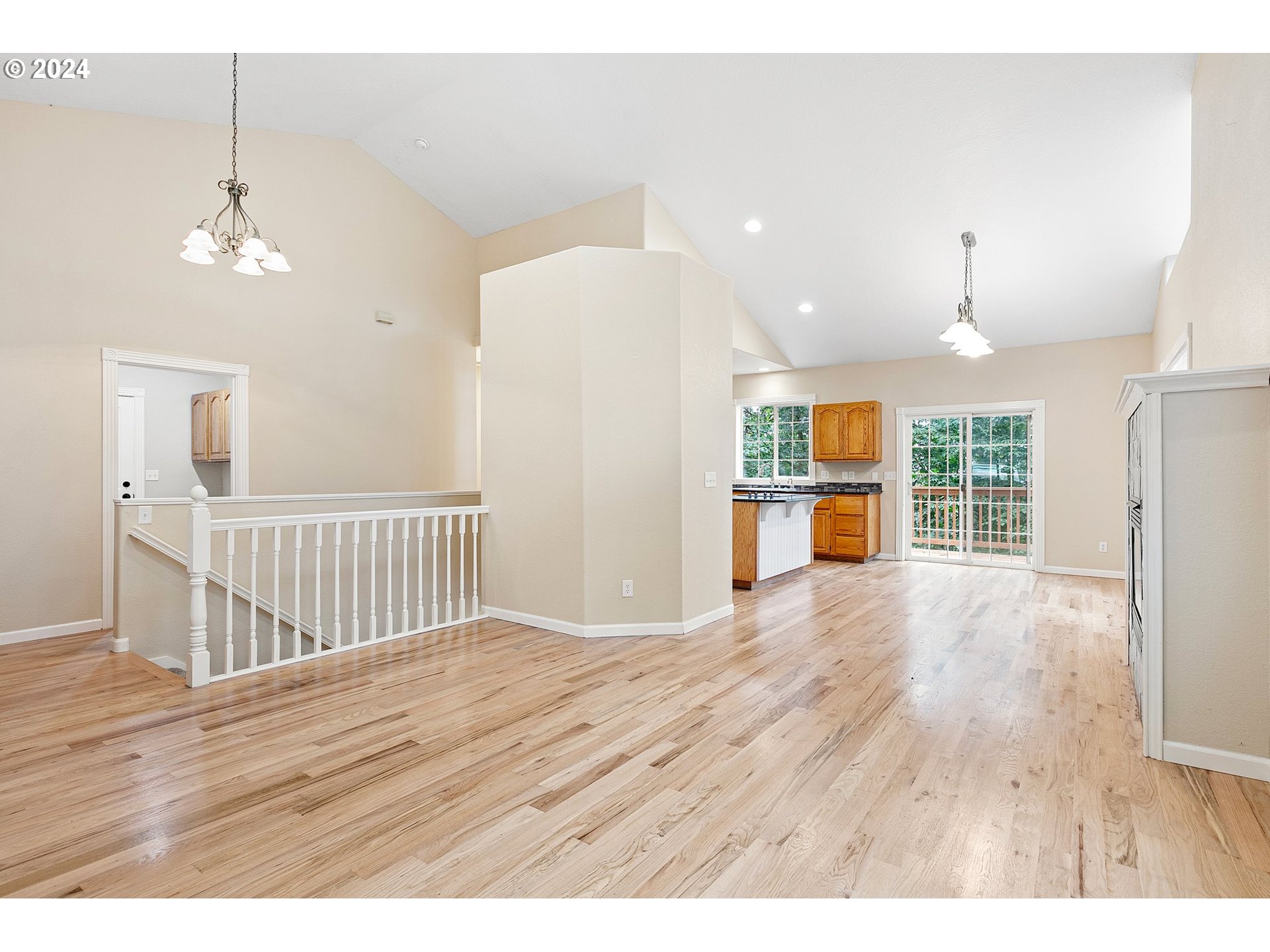 626 South 73rd Street Springfield, OR 97478 - Photo 4 of 46 a view of an empty room with wooden floor and a window