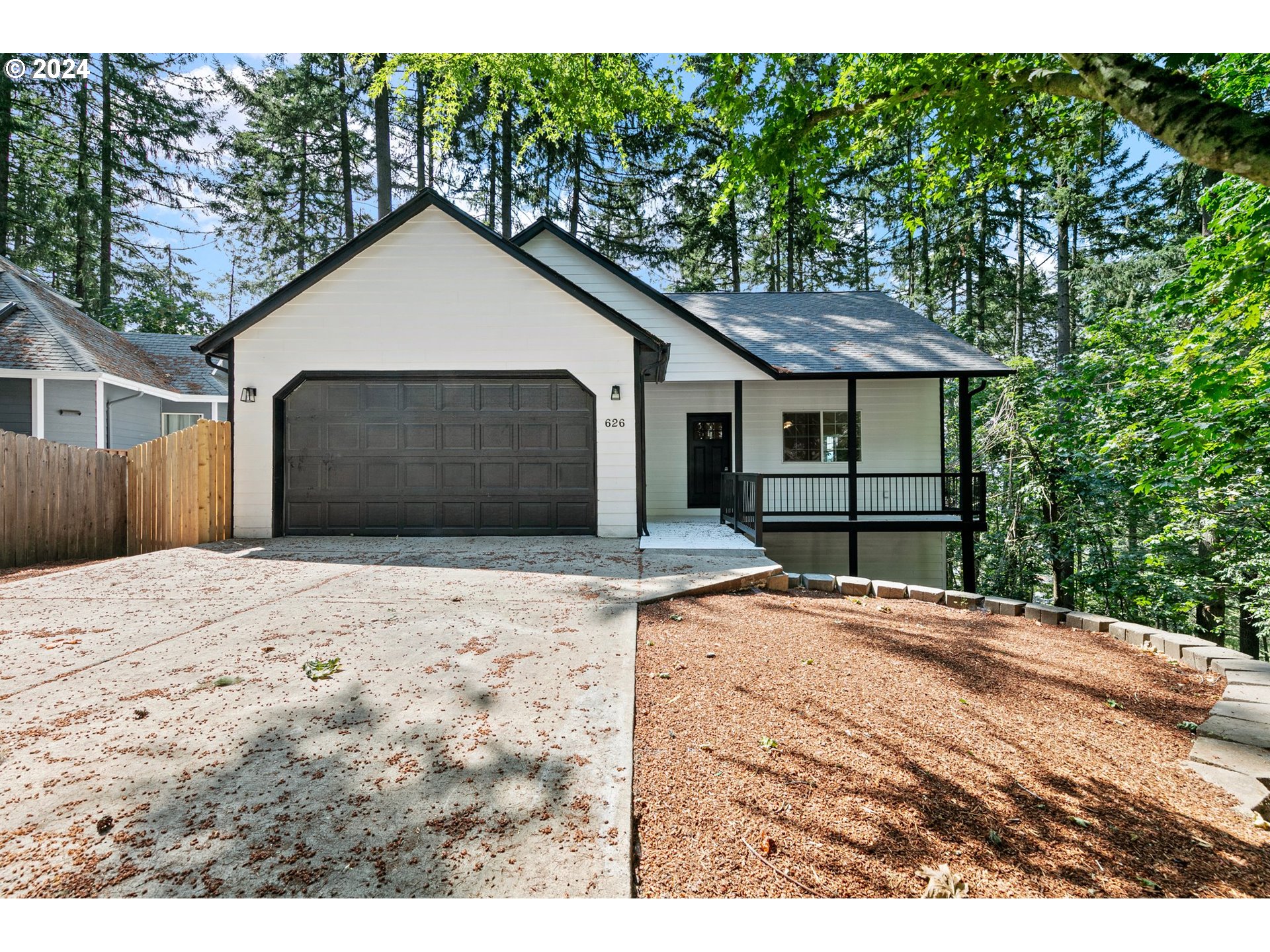 626 South 73rd Street Springfield, OR 97478 - Photo 46 of 46 a backyard of a house with a yard and garage