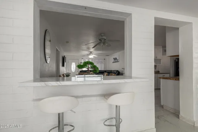 a kitchen with a sink and a refrigerator