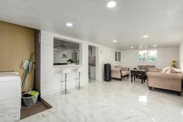 a living room with furniture and a table