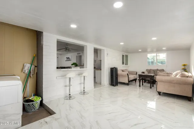 a living room with furniture and a table