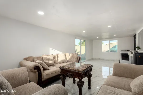 a living room with furniture and a window