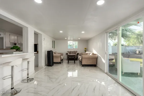 a lobby with furniture and a floor to ceiling window