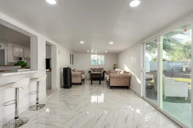 a lobby with furniture and a floor to ceiling window