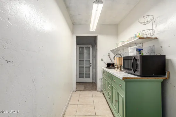 a kitchen with stainless steel appliances a sink stove and microwave