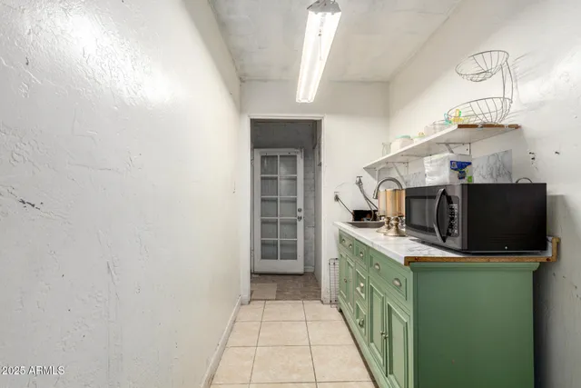 a kitchen with stainless steel appliances a sink stove and microwave