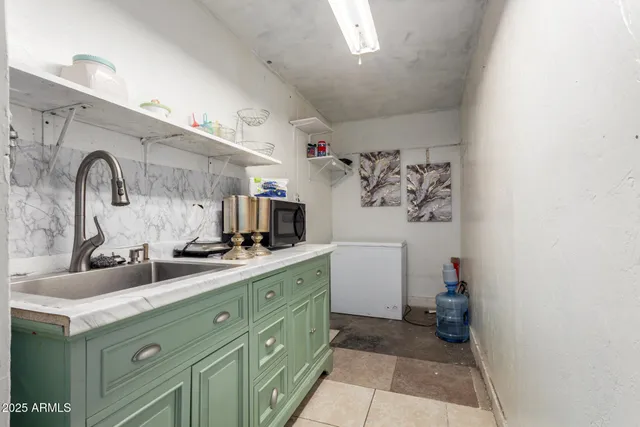 a bathroom with a double vanity sink mirror and toilet
