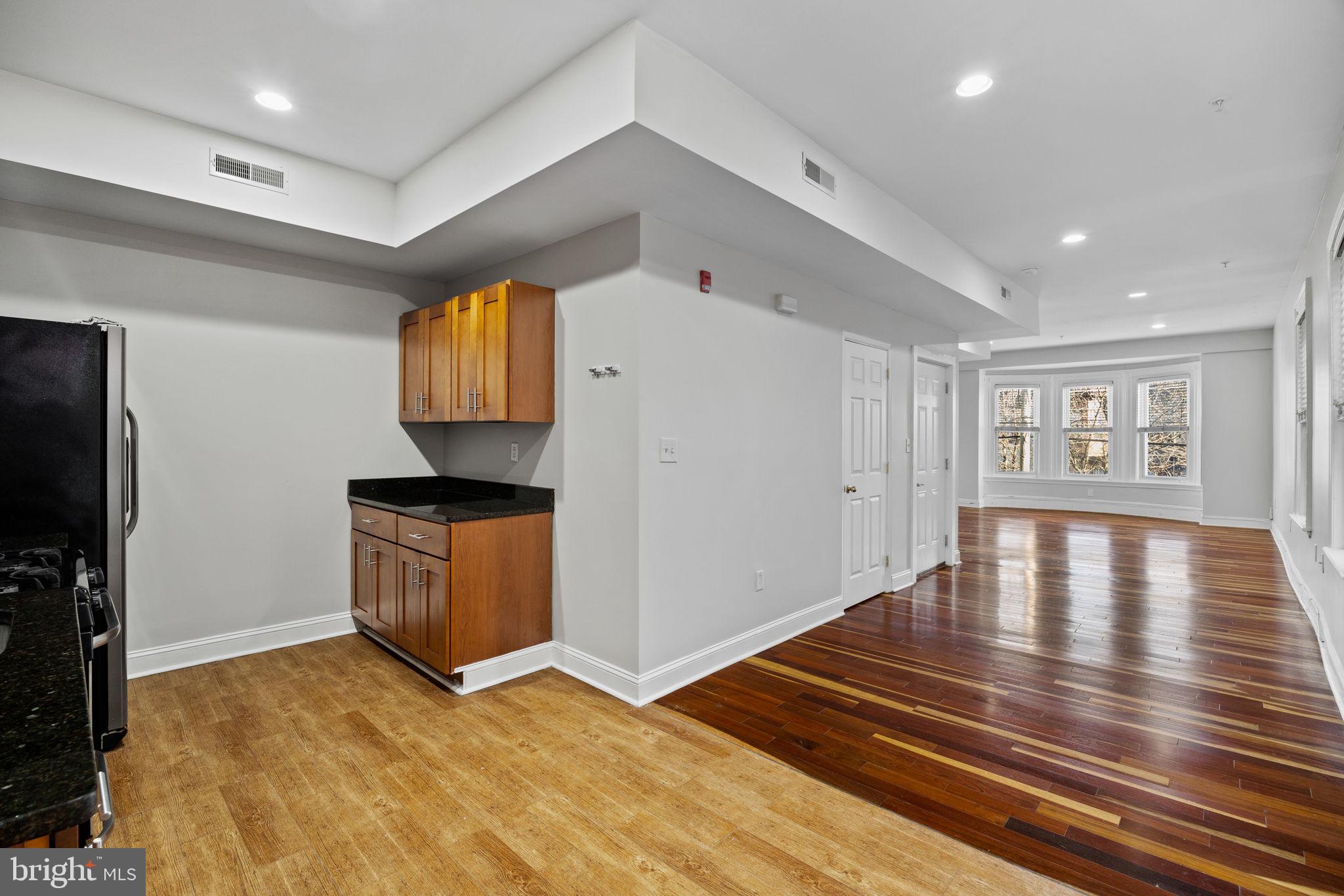 426 South 44th Street, Unit 2 Philadelphia, PA 19104 - Photo 13 of 29 a view of kitchen and dining room with wooden floor