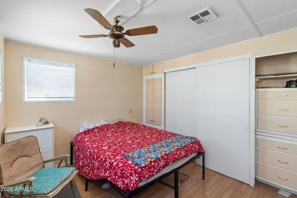 a view of a dining room with furniture and a book shelf