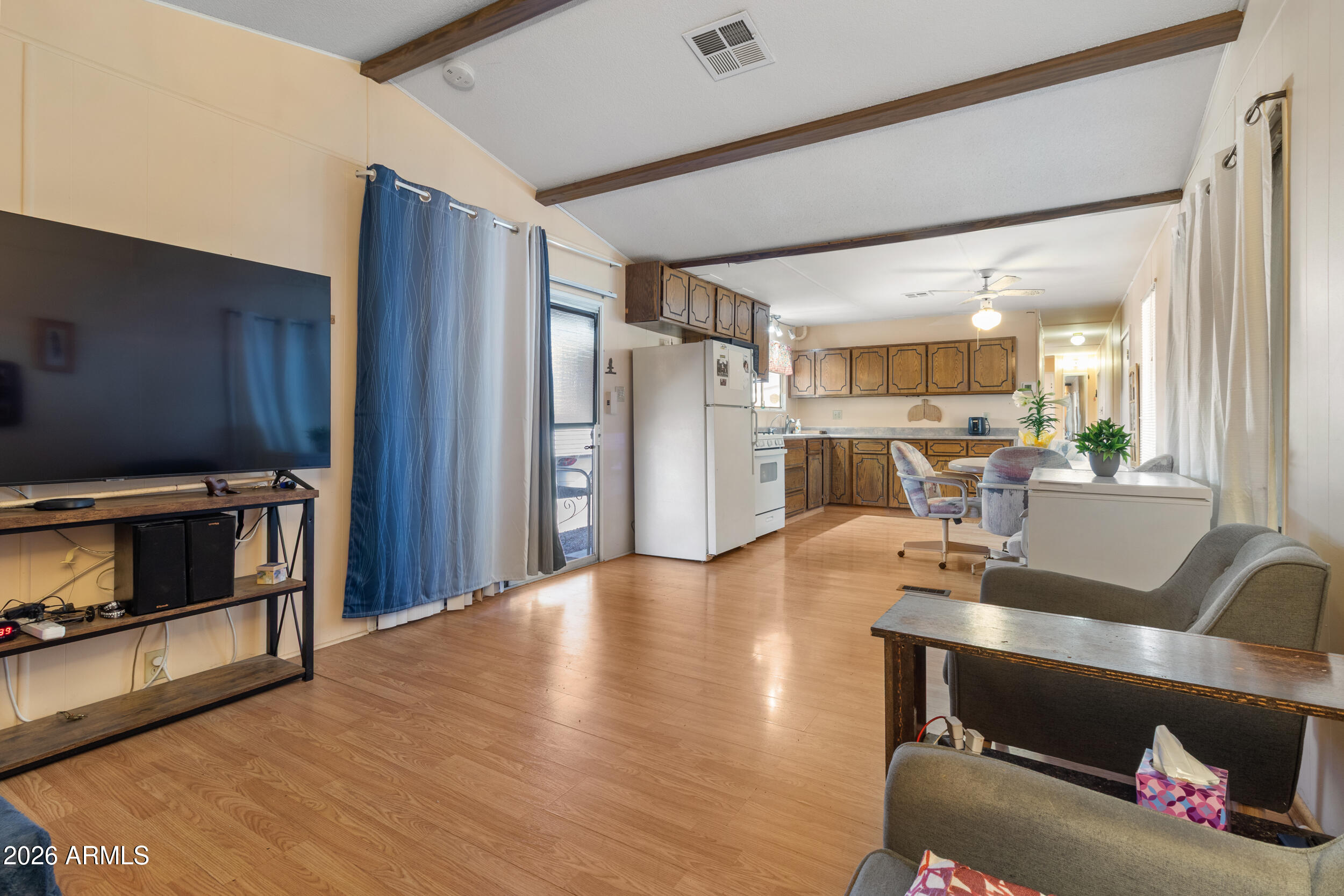 701 South Dobson Road, Unit 343 Mesa, AZ 85202 - Photo 2 of 70 a living room with stainless steel appliances kitchen island granite countertop furniture and a fireplace