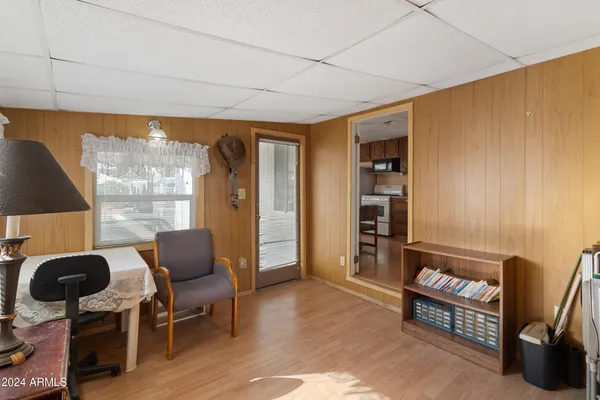 a living room with furniture window and wooden floor