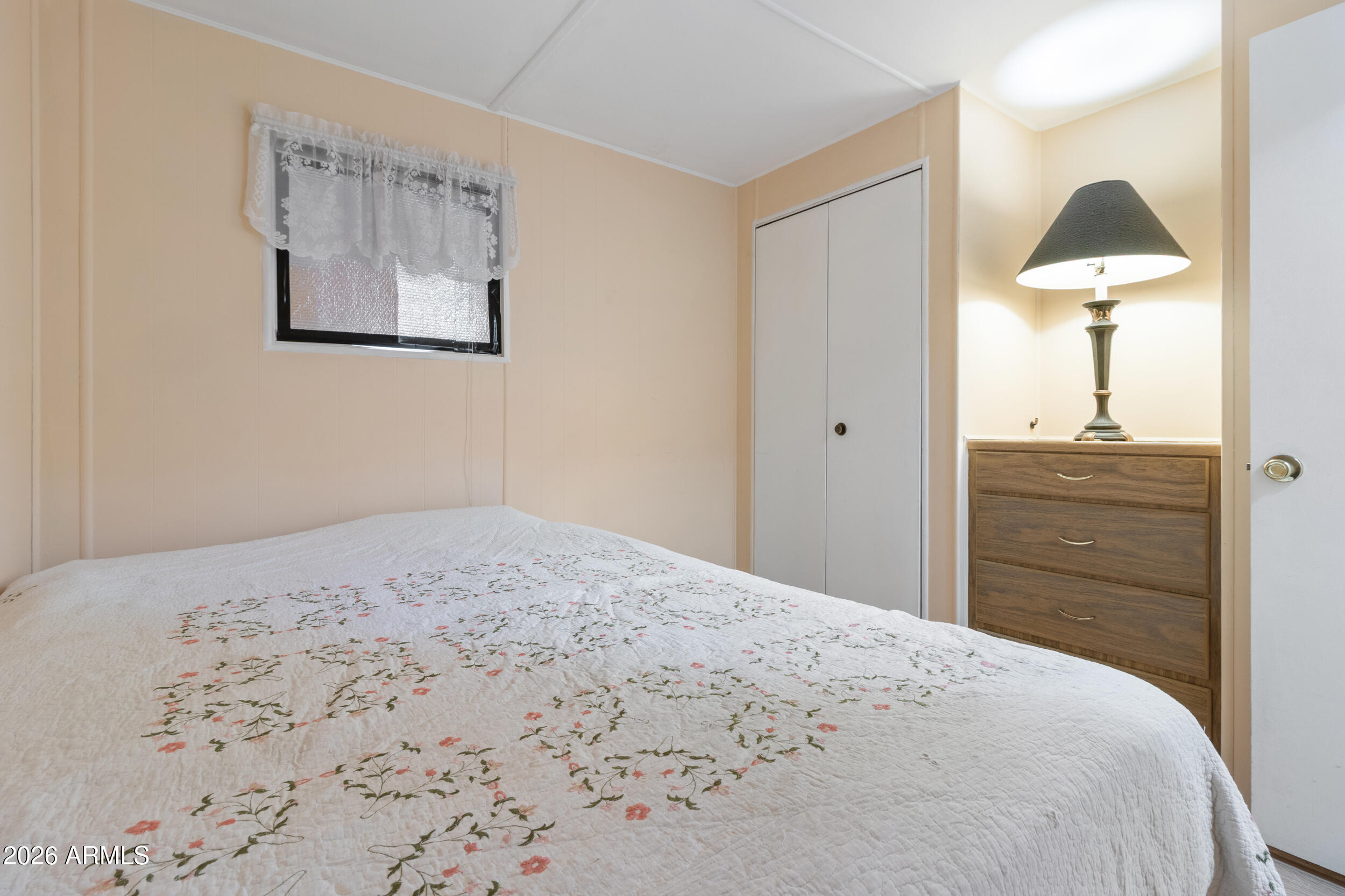 701 South Dobson Road, Unit 343 Mesa, AZ 85202 - Photo 5 of 70 a bedroom with a bed and a chandelier