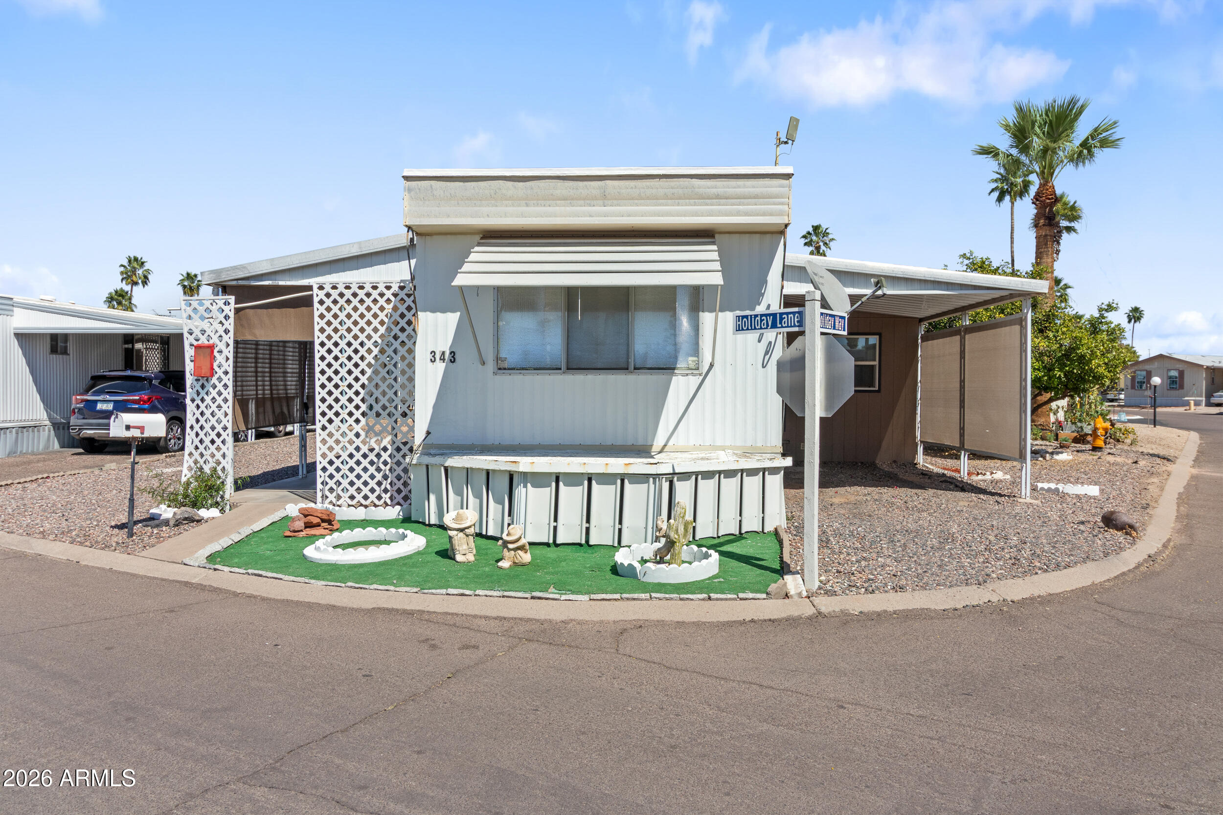 701 South Dobson Road, Unit 343 Mesa, AZ 85202 - Photo 57 of 70 a view of a house with a small yard and plants