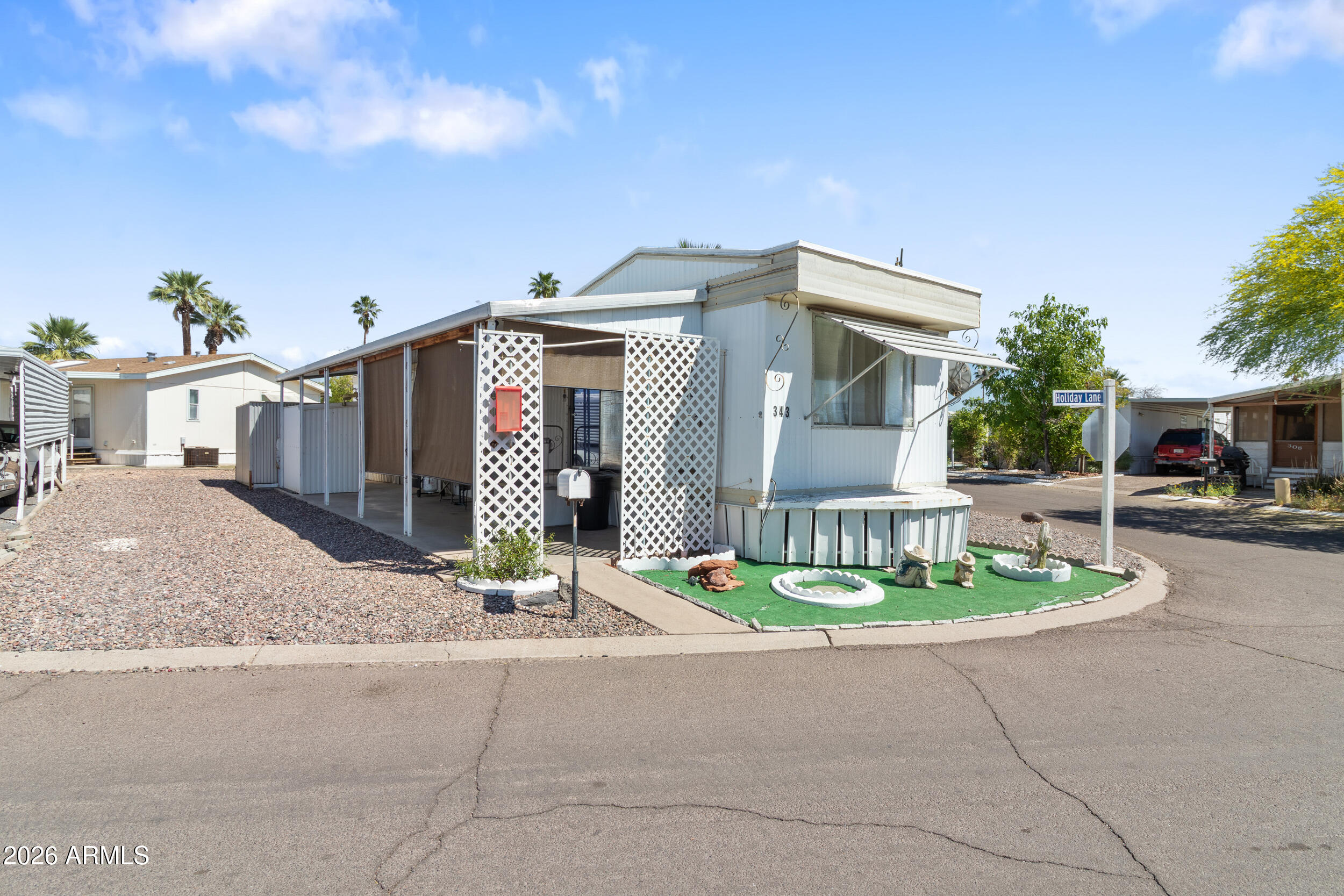 701 South Dobson Road, Unit 343 Mesa, AZ 85202 - Photo 58 of 70 a front view of a house with a yard and tree s