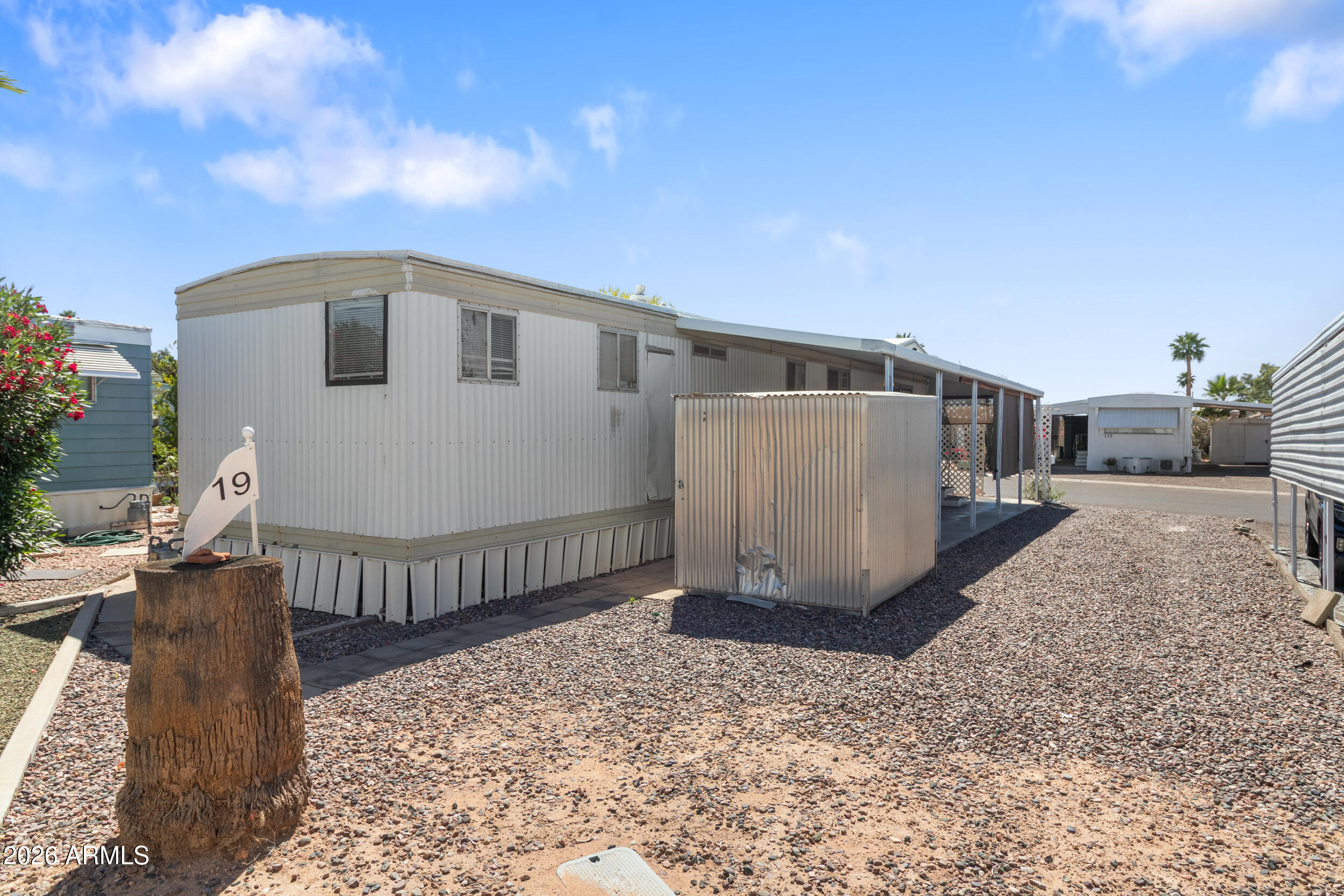 701 South Dobson Road, Unit 343 Mesa, AZ 85202 - Photo 66 of 70 a view of a house with wooden fence