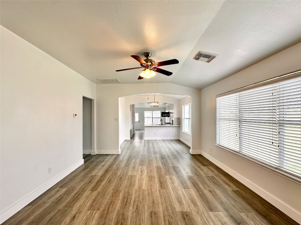 8202 Radial Court Rosharon, TX 77583 - Photo 2 of 27 a view of a house with wooden floor and a ceiling fan