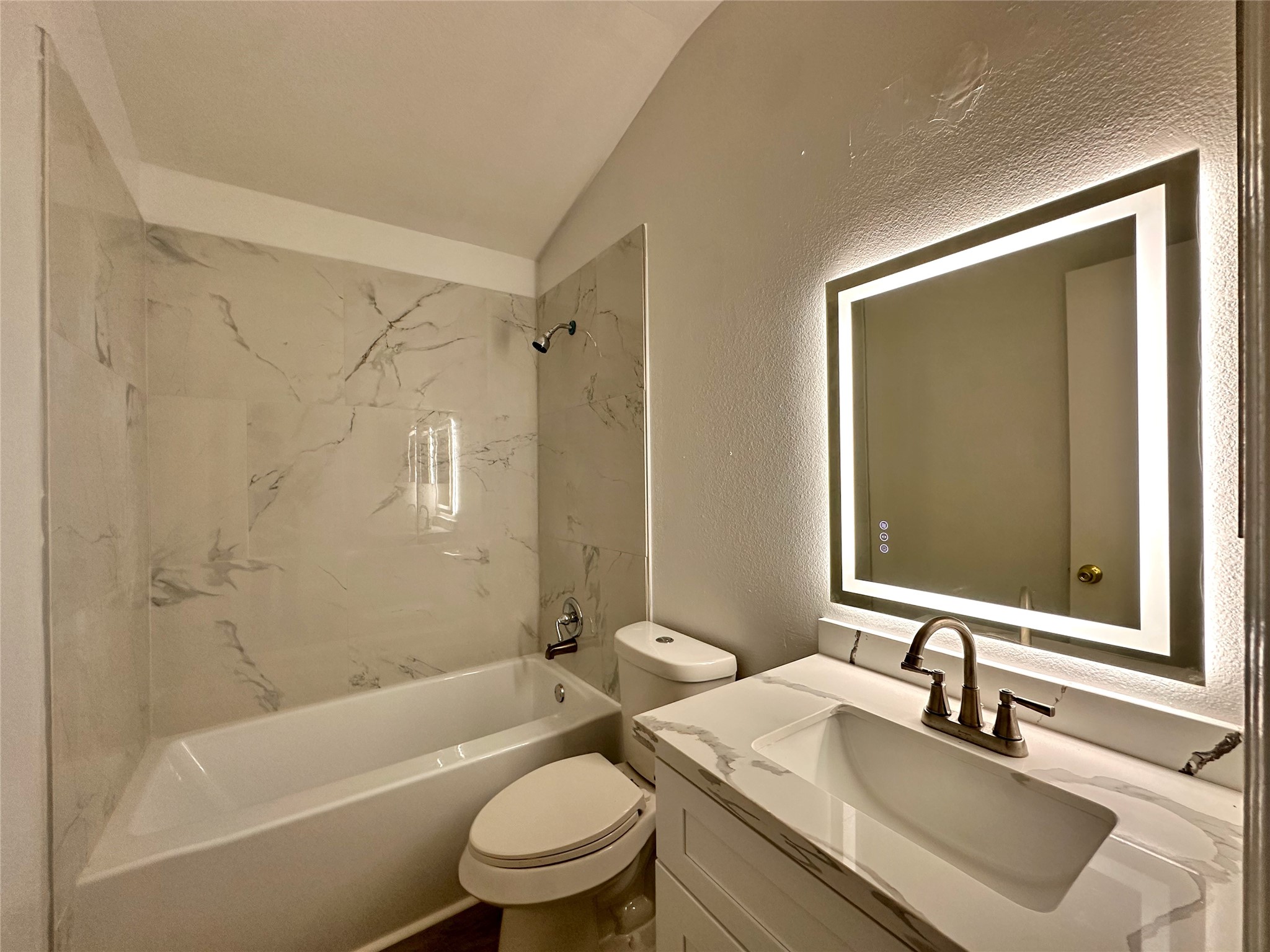 8202 Radial Court Rosharon, TX 77583 - Photo 25 of 27 a bathroom with a granite countertop sink toilet tub and shower