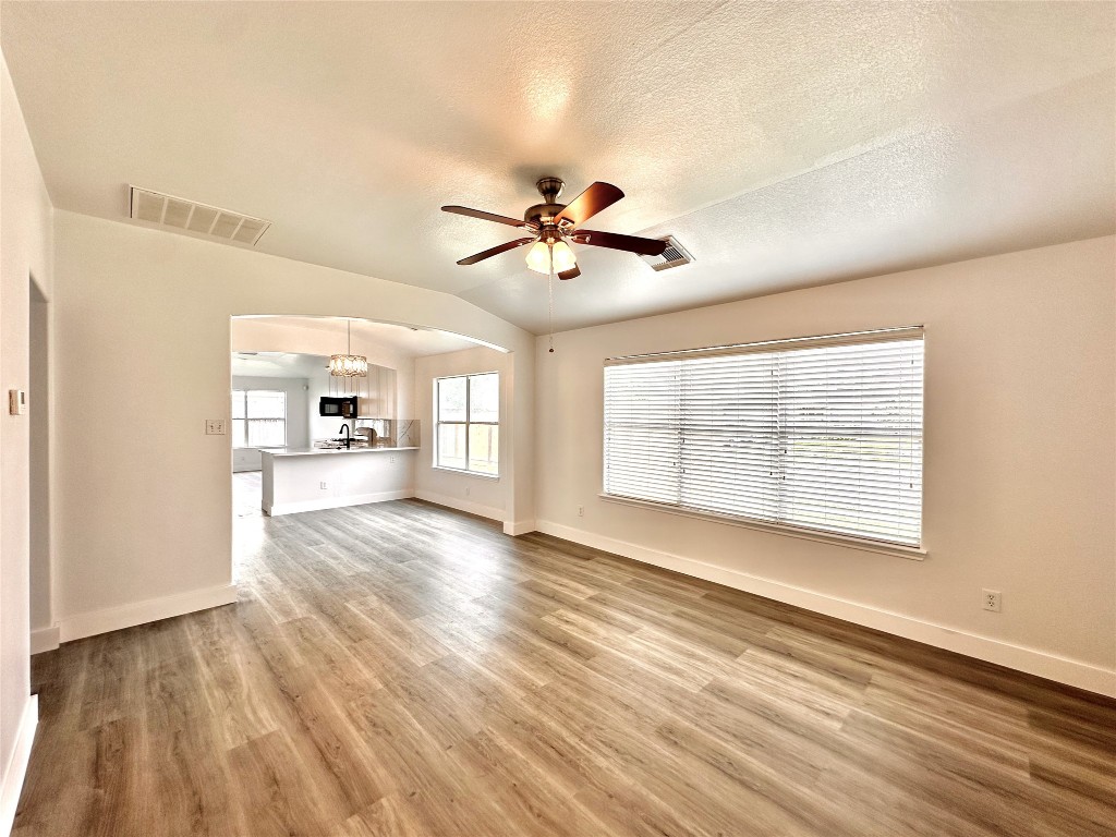 8202 Radial Court Rosharon, TX 77583 - Photo 3 of 27 a view of an empty room with window and wooden floor