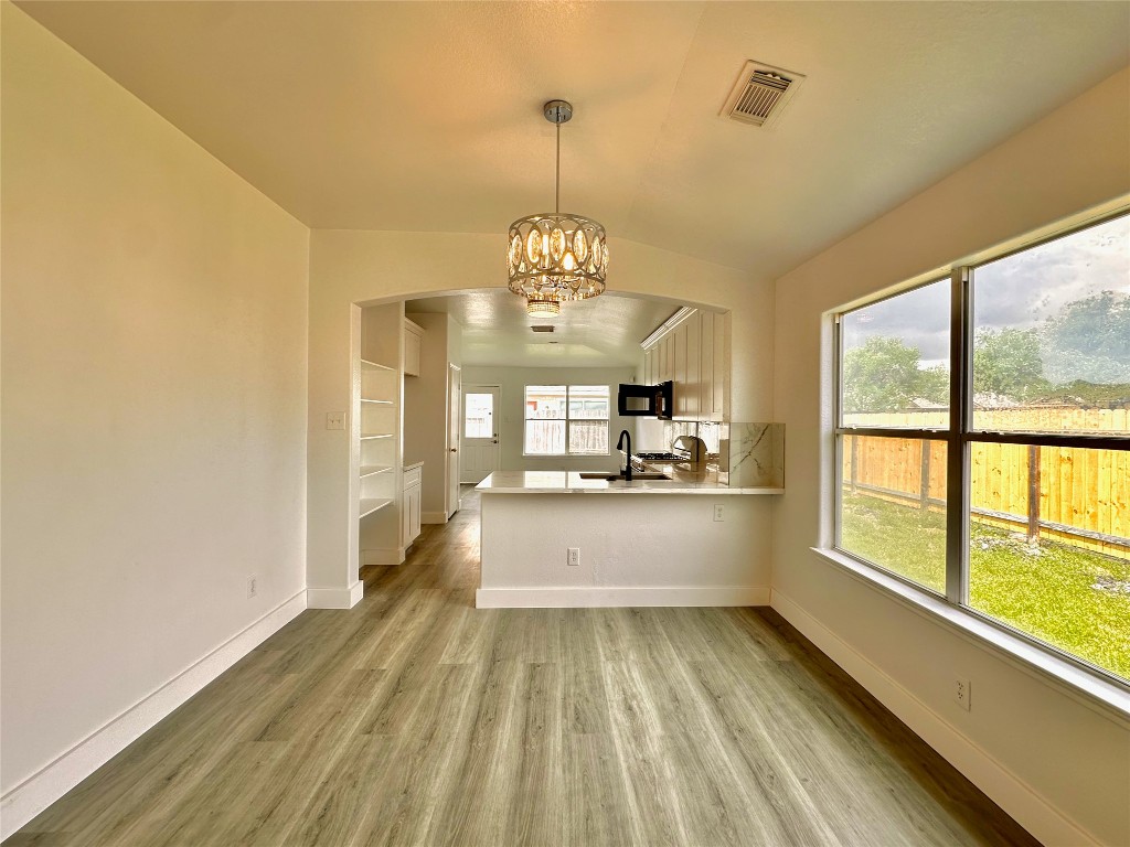 8202 Radial Court Rosharon, TX 77583 - Photo 6 of 27 a large white kitchen with a large window