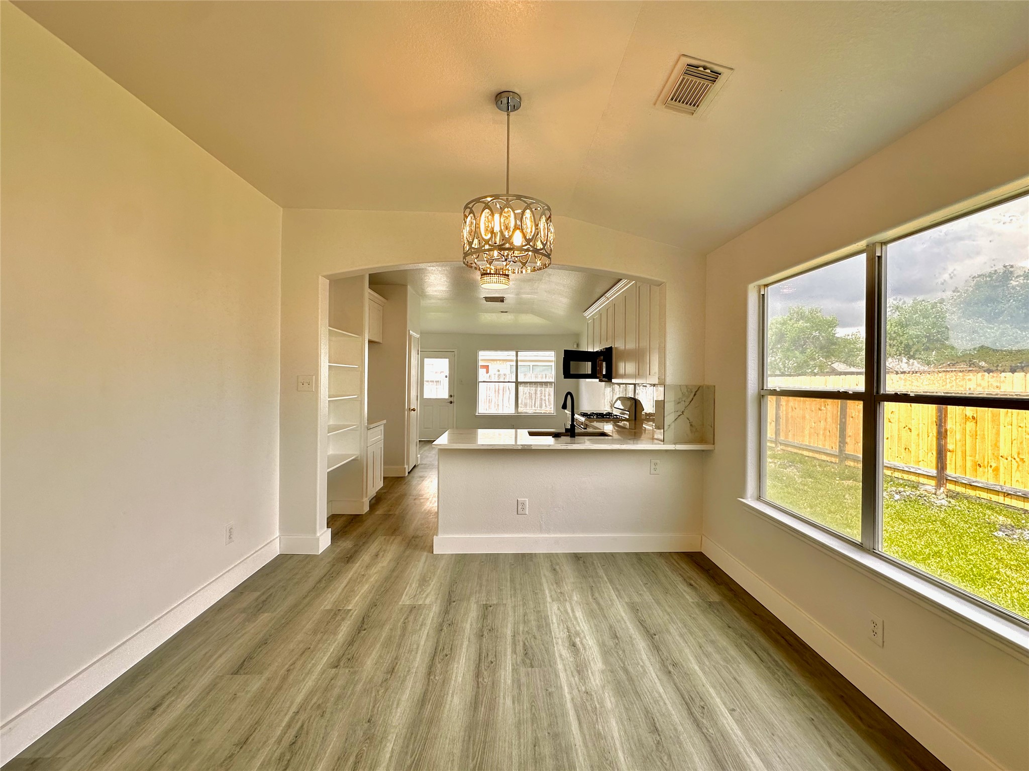 8202 Radial Court Rosharon, TX 77583 - Photo 6 of 27 a large white kitchen with a large window