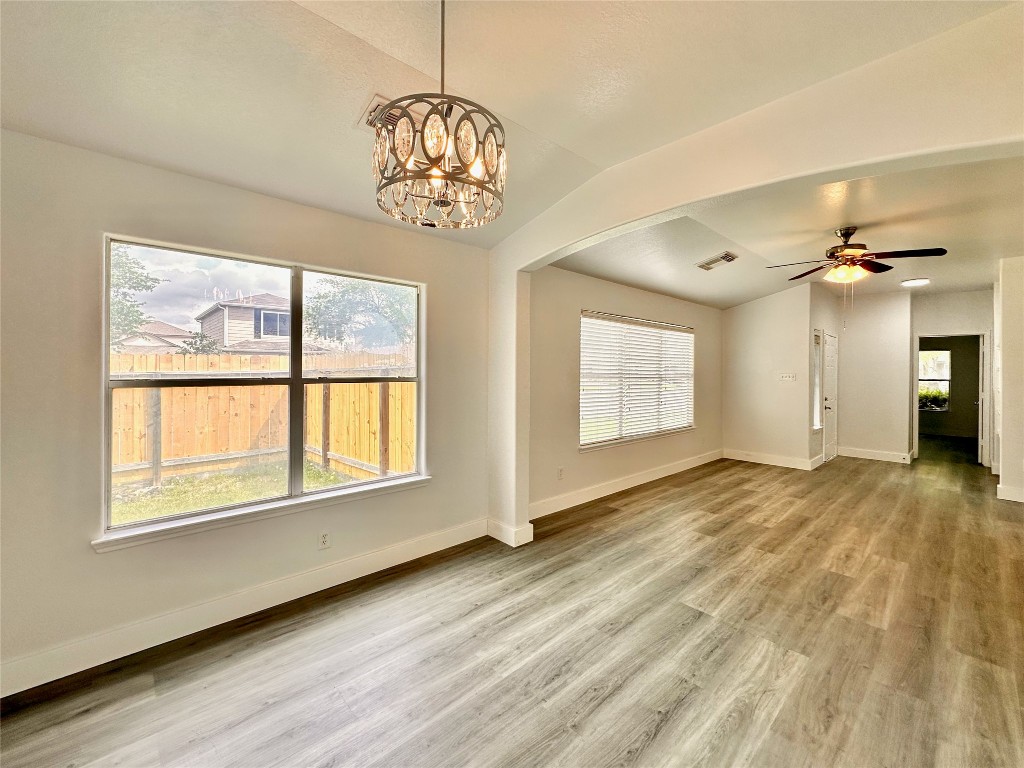 8202 Radial Court Rosharon, TX 77583 - Photo 8 of 27 a view of an empty room with a window and wooden floor