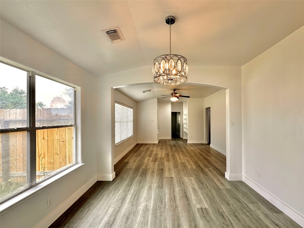 8202 Radial Court Rosharon, TX 77583 - Photo 9 of 27 a view of empty room with wooden floor and fan