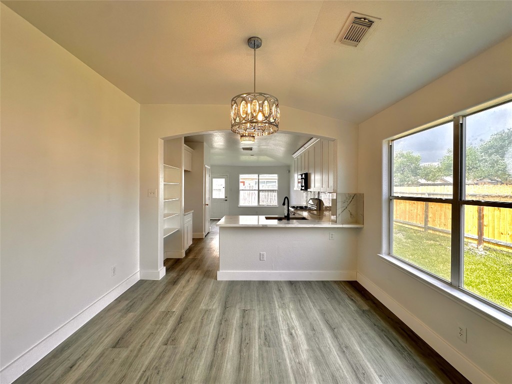 8202 Radial Court Rosharon, TX 77583 - Photo 10 of 27 a large white kitchen with a large window