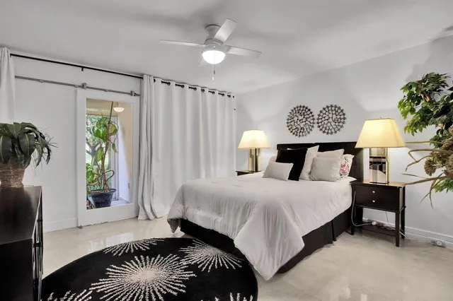 a bedroom with a bed and a table in it