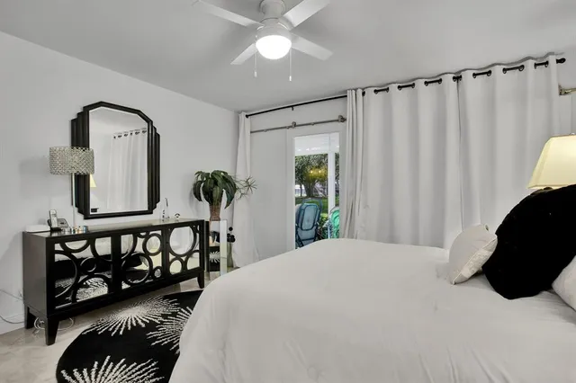 a bedroom with furniture and a window