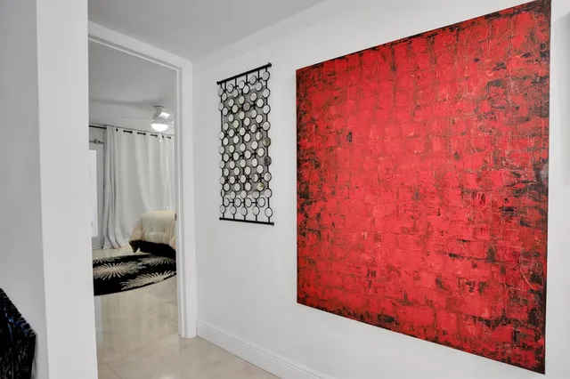 a view of swimming pool with outdoor seating and trees in the background