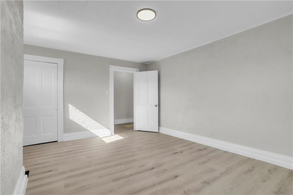 1229 McKee Road Crescent, PA 15046 - Photo 15 of 32 a view of an empty room with wooden floor