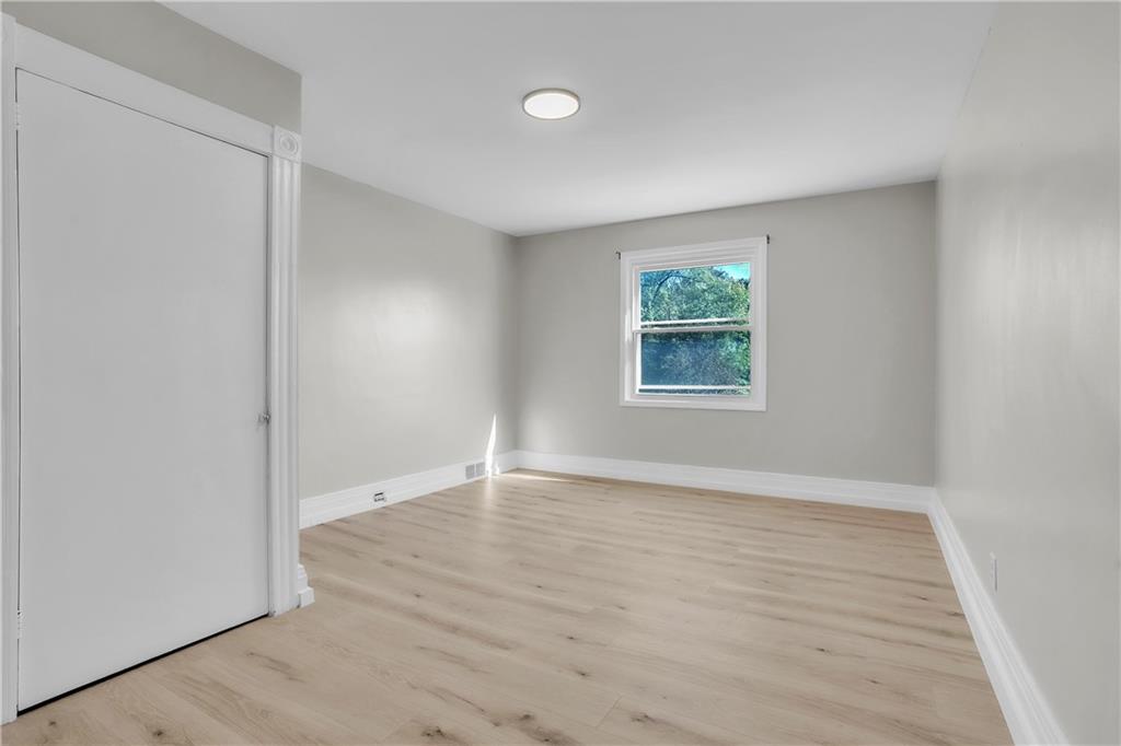 1229 McKee Road Crescent, PA 15046 - Photo 19 of 32 an empty room with wooden floor and windows