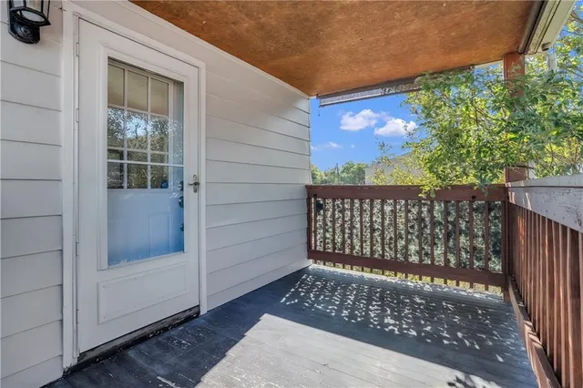 a kitchen with a refrigerator stove and white cabinets