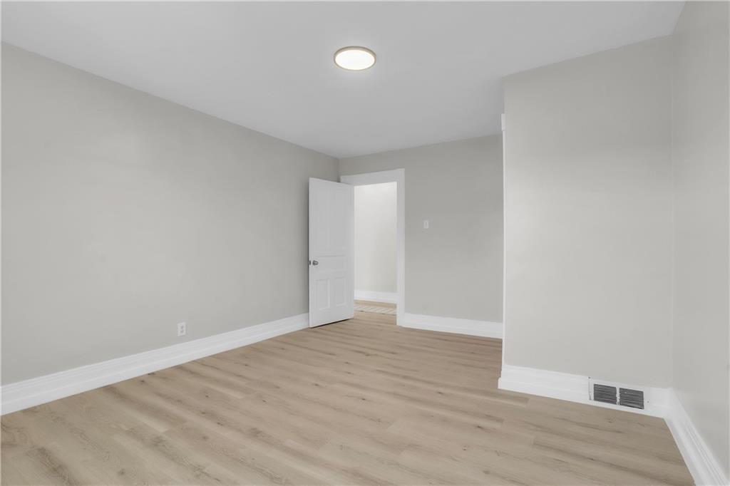 1229 McKee Road Crescent, PA 15046 - Photo 21 of 32 a view of an empty room with wooden floor