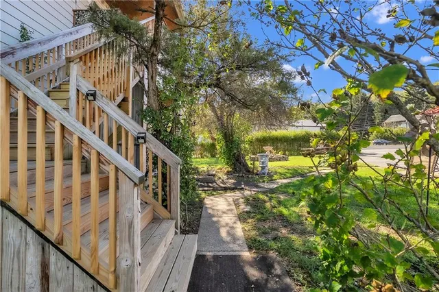 a view of a house with a yard porch and sitting area