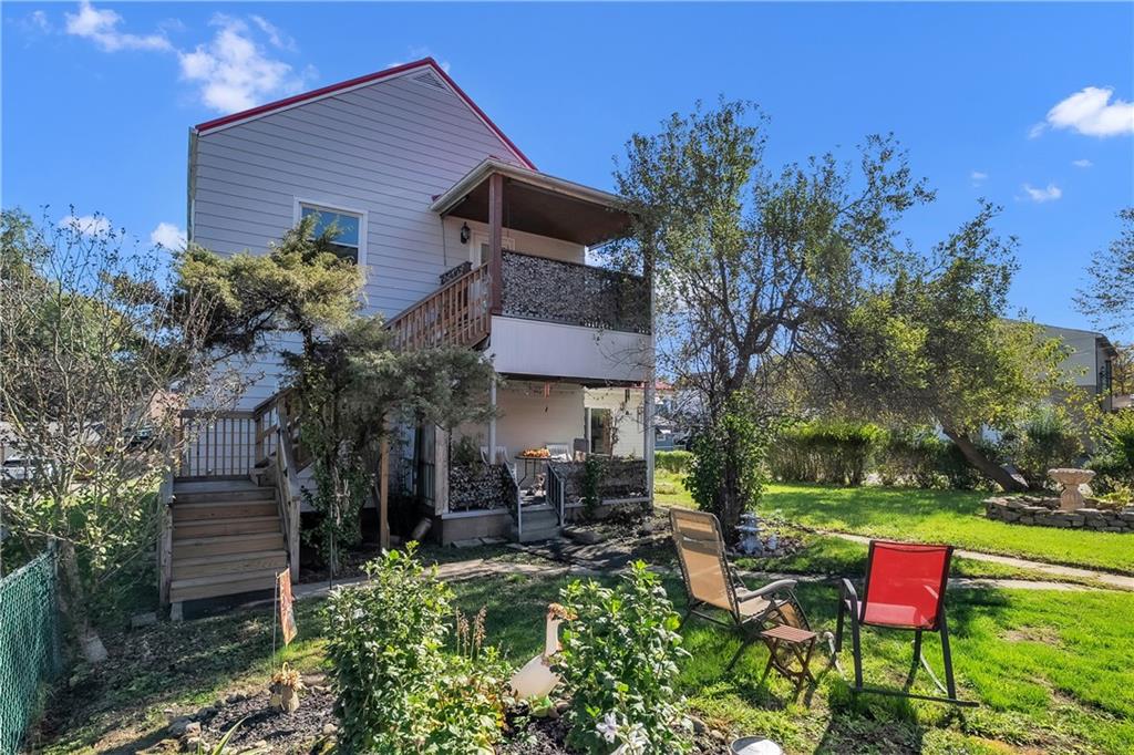 1229 McKee Road Crescent, PA 15046 - Photo 28 of 32 a backyard of a house with outdoor seating