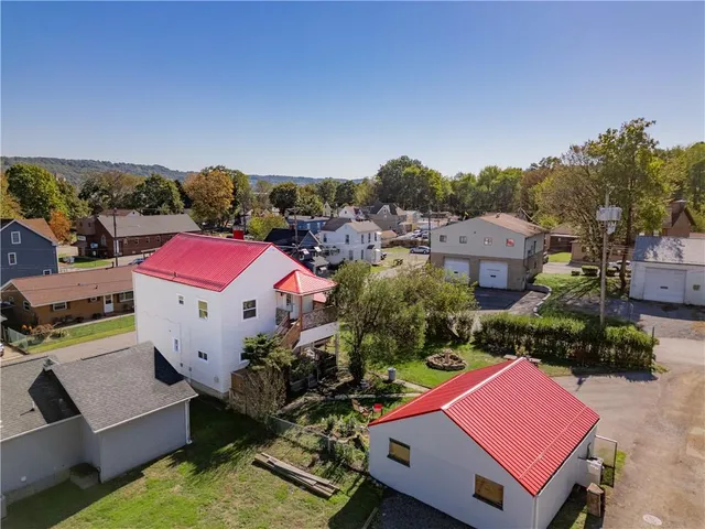 an aerial view of houses and roads