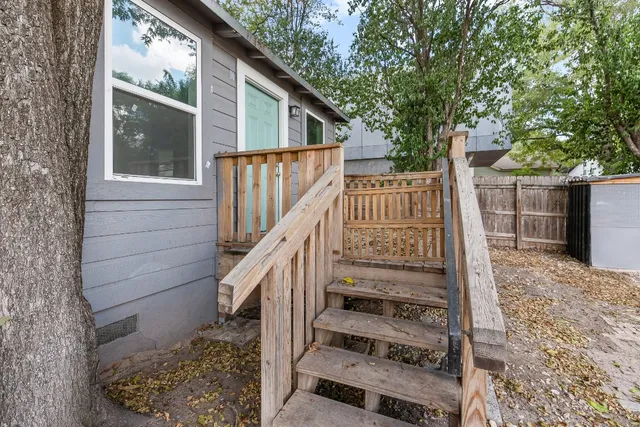 a view of entryway with wooden floor and a tree
