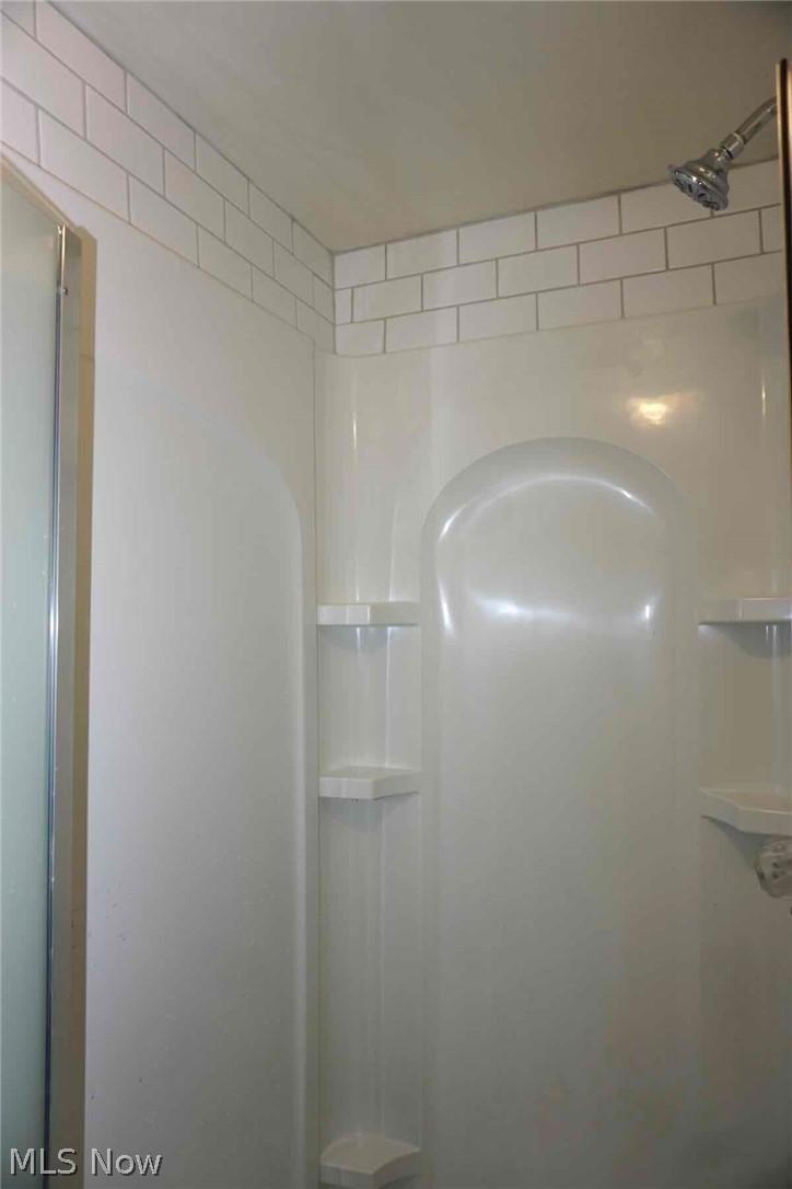 2168 Edgewood Road Cleveland, OH 44118 - Photo 30 of 41 3rd fl bathroom shower with subway tile above.