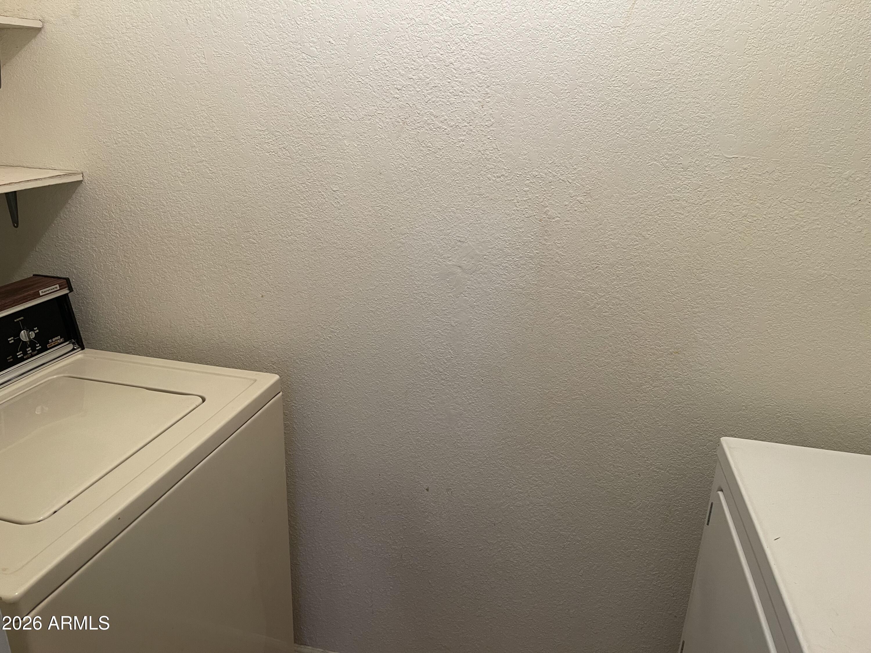 623 West Guadalupe Road, Unit 257 Mesa, AZ 85210 - Photo 12 of 14 a utility room with dryer and washer