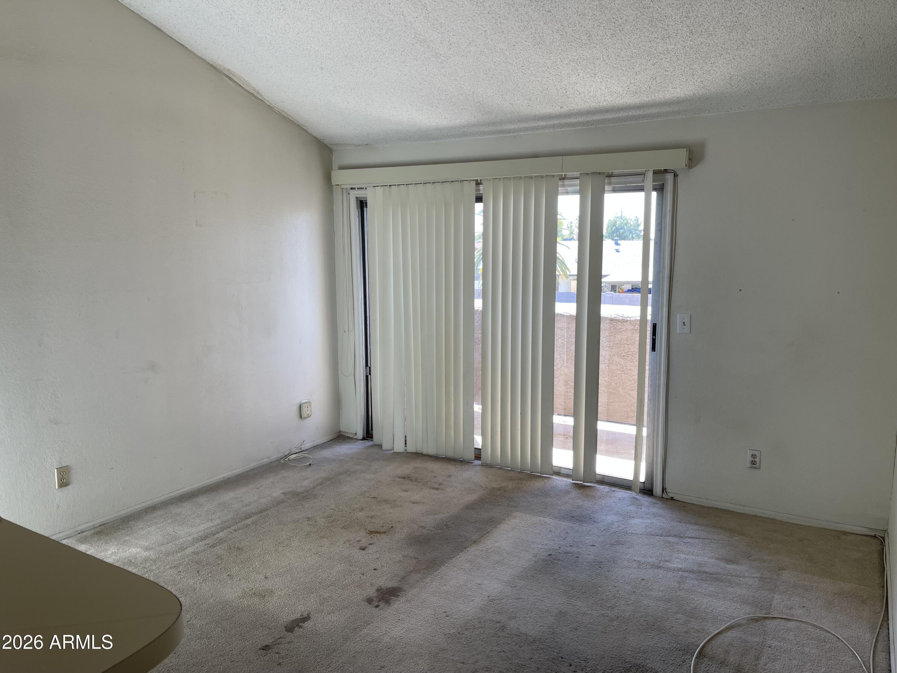 623 West Guadalupe Road, Unit 257 Mesa, AZ 85210 - Photo 2 of 14 an empty room with windows