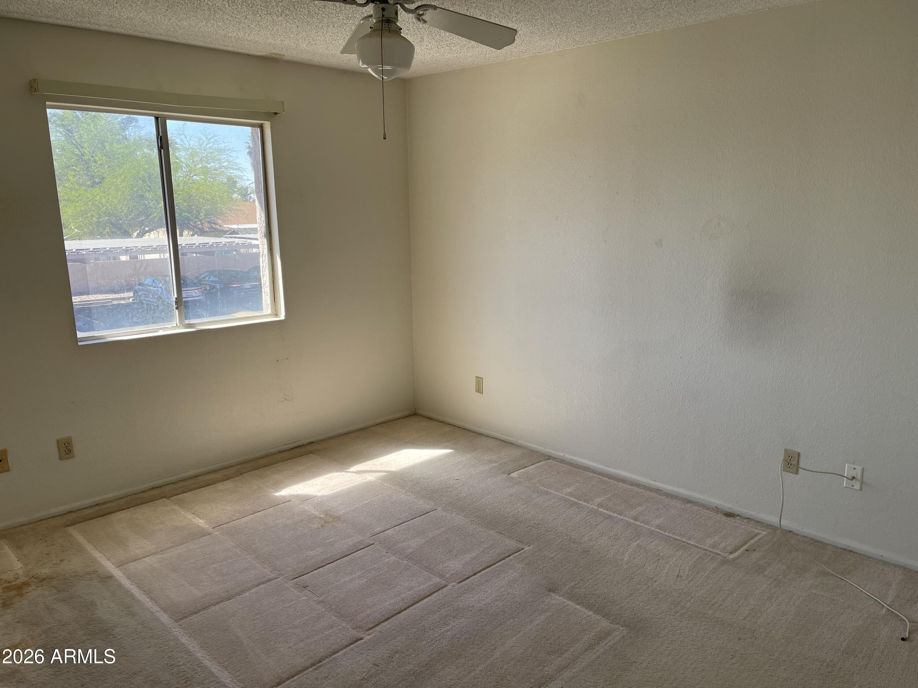 623 West Guadalupe Road, Unit 257 Mesa, AZ 85210 - Photo 7 of 14 an empty room with a window