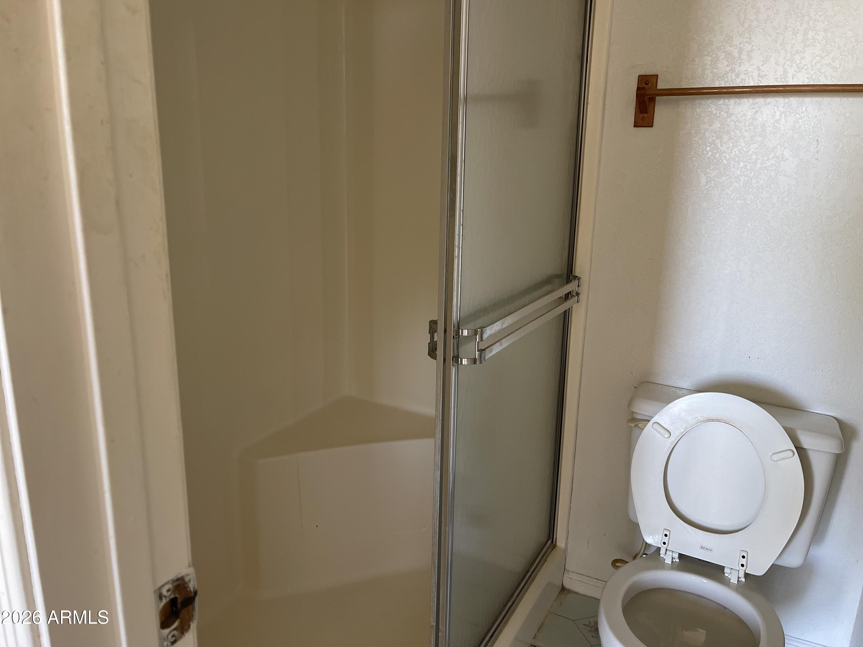 623 West Guadalupe Road, Unit 257 Mesa, AZ 85210 - Photo 9 of 14 a bathroom with a toilet and a shower