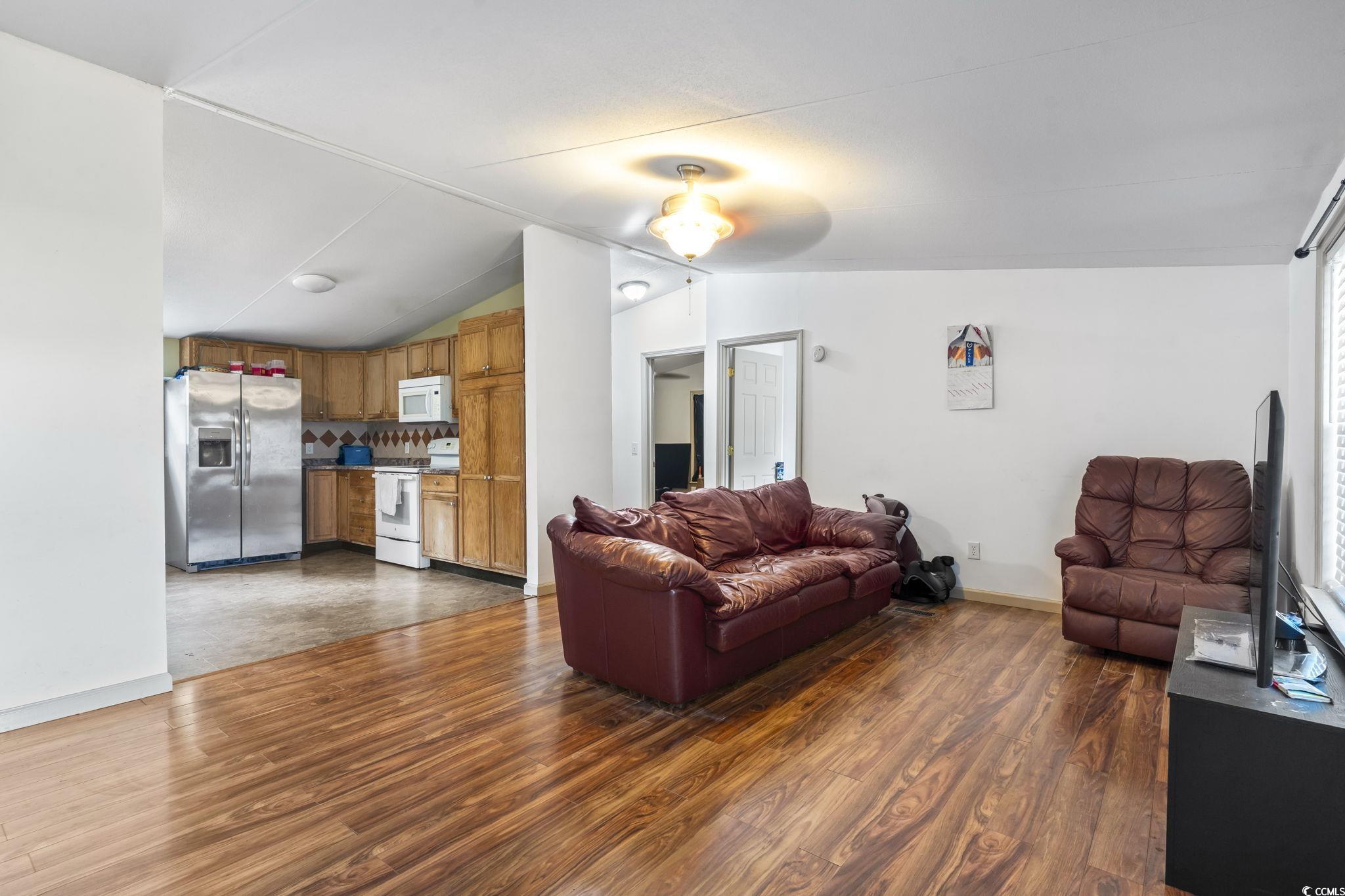 1585 Daisy Road Loris, SC 29569 - Photo 29 of 48 Living room featuring lofted ceiling and dark wood-style floors
